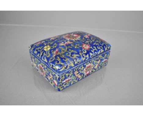 A 20th Century Chinese Porcelain Enamel Box Decorated with Flowers and Foliage on Blue Ground, 12x9x6cm High 