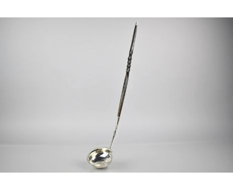 A George III Silver Toddy Ladle with Lip Bowl Having Inset Coin Centre with Baleen Twisted Handle, 36cms Log (Unmarked) 