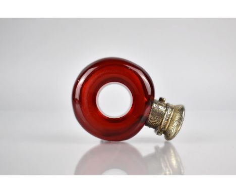 A 19th Century White Metal Mounted Ruby Glass Scent Bottle of Torus/ Ring Form, The Lid With Chased Decoration and Inscribed 