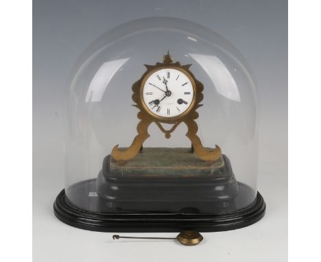 A late 19th century lacquered brass skeleton clock with eight day movement striking on a bell via an outside countwheel, with