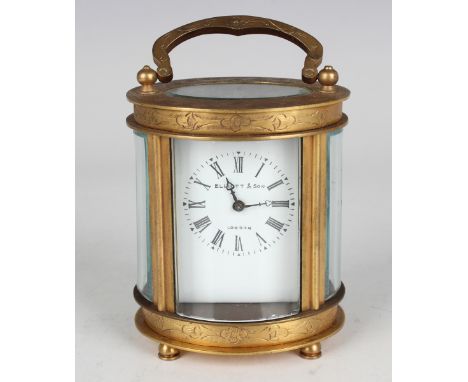 A 20th century Chinese brass oval cased carriage timepiece, the enamelled dial with black Roman hour numerals, the case with 