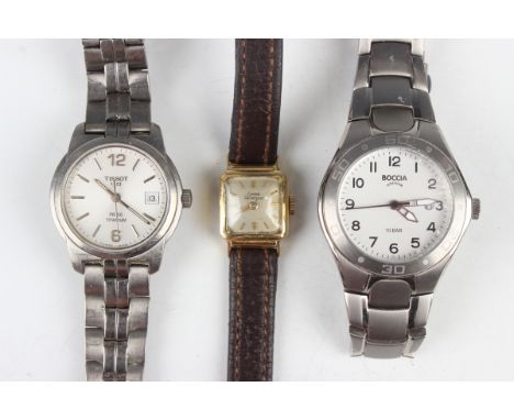 A Girard Perregaux 18ct gold cased lady's wristwatch, case width 1.5cm, on a brown leather strap, together with a Tissot PR50