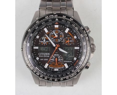A Citizen Eco-Drive WR 200 titanium cased gentleman's bracelet wristwatch, the signed black dial with subsidiary dials and di