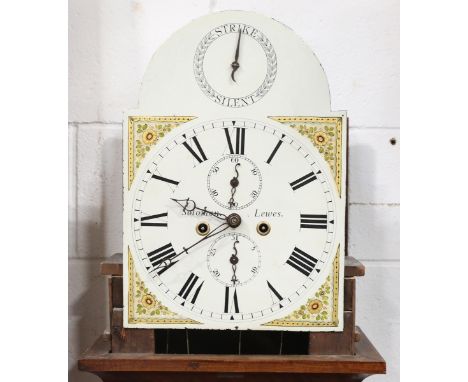 An early 19th century mahogany longcase clock with eight day movement striking on a bell, the 12-inch painted breakarch dial 