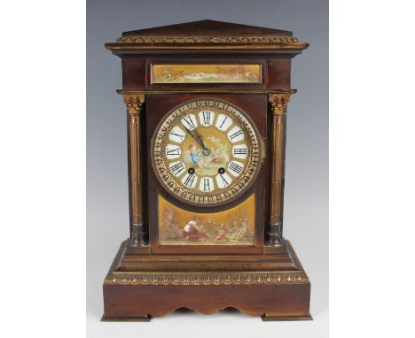 A late 19th century French brown patinated brass and porcelain mounted mantel clock with eight day movement striking on a gon