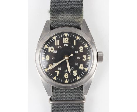 A Benrus US military issue steel cased gentleman's wristwatch, the unsigned black dial with Arabic hours to '12' and '24', th