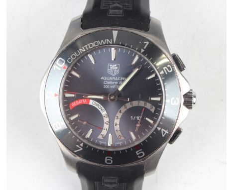 A Tag Heuer Automatic caliber 300 metres stainless steel cased gentleman's chronograph wristwatch, the signed dark grey dial 