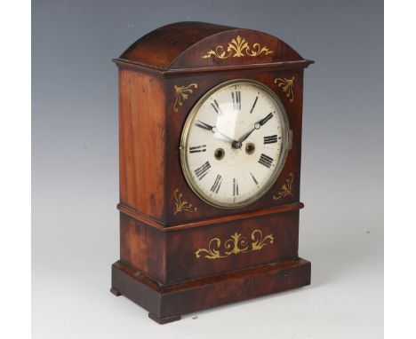 A 19th century Black Forest brass inlaid mahogany mantel clock with eight day movement striking on a gong, the 7-inch painted