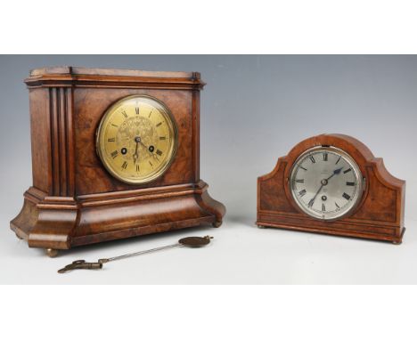 A late 19th century walnut cased mantel clock with eight day movement striking on a bell, the brass dial with black Roman hou