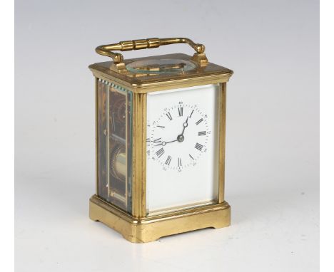 A late 19th century French lacquered brass cased carriage clock with eight day movement striking hours and repeating on a gon