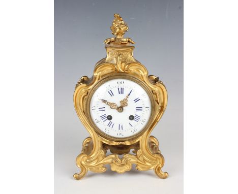 A late 19th century Louis XV style ormolu cased mantel clock with eight day movement striking on a bell, the backplate stampe
