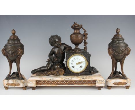 A late 19th century French spelter and marble clock garniture, the clock with eight day movement striking on a bell via an ou