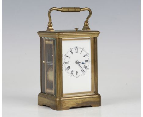 An early 20th century French brass cased carriage clock with eight day movement striking hours, half hours and repeating on a