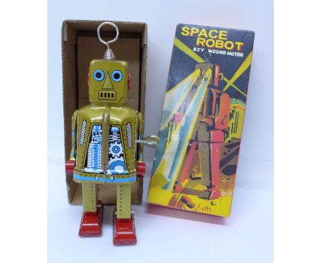 A tin-plate key wound motor space robot, made in China, boxed
