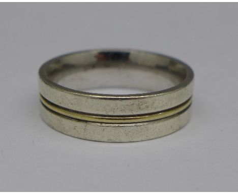 A silver and 9ct gold ring, marked 925 and 375, S