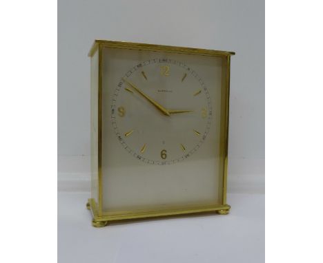A brass cased Garrard 8 days mantel clock, the case back bears inscription, 15.5cm
