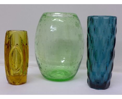 A controlled bubble green glass vase, a Sklo Union bullet vase designed by R. Schrotter and a blue glass vase