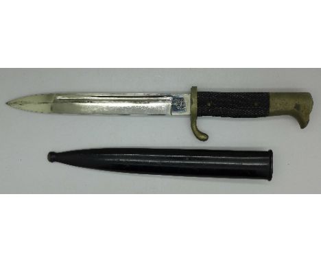 A German bayonet with scabbard, the blade marked Alcoso, Solingen