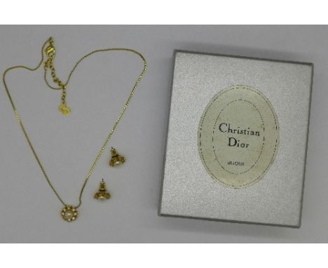 A Christian Dior pendant and chain and a pair of matching earrings, boxed