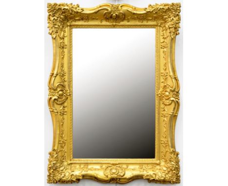 A VICTORIAN GILTWOOD AND COMPOSITION PICTURE FRAME, NOW WITH BEVELLED MIRROR, 73CM H, SOME LOSS