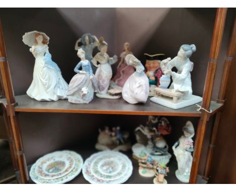 2 shelf's of collectables to include lladro , nao etc mostly as found . 