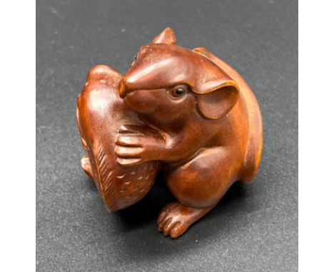 Hand carved Japanese Netsuke sculpture of a Mouse holding a koi carp. [5.2cm high] 