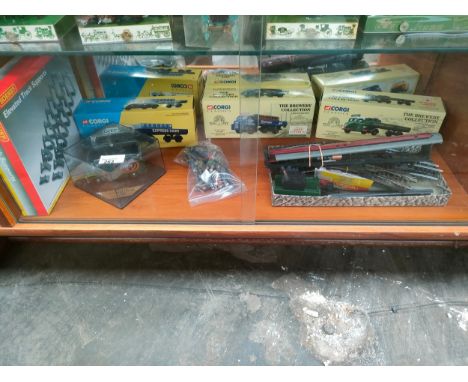 Shelf of boxed corgi trucks , train items etc 