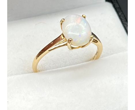 10ct yellow gold ladies ring set with a single oval opal stone. [Ring size R] [1.71GRAMS] 