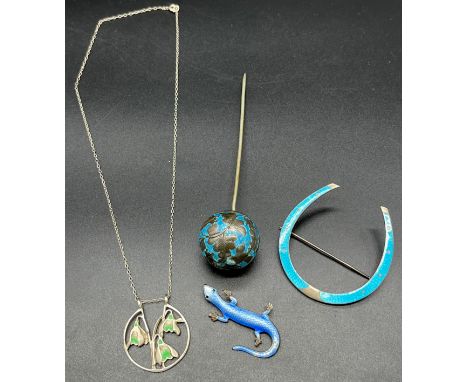 Four items of silver and enamel. Includes Chinese Export silver and blue enamel hat pin, 900 grade silver and blue enamel hor