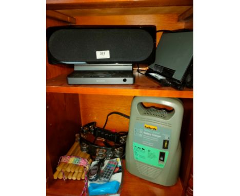 2 shelf of miscellaneous includes docking station s , music instruments etc 