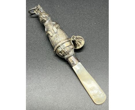 Birmingham silver and mother of pearl handle baby rattle. Silver is formed in the shape of a rabbit [10.5cm in length] 