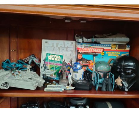 Large shelf of star war toys includes millennium falcon , R2d2 etc 