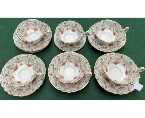 Antique Royal Doulton flower design and blue trim tea service. 