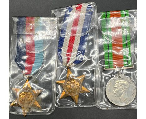 Three WW2 Medals, Defence medal, France and Germany star and one other star medal. 