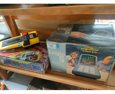 Shelf of vintage hand held games 