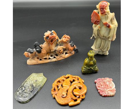 A Lot of Chinese Hardstone, soapstone and jade sculptures. Includes amulets and figures. 