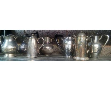 SHELF WITH VARIOUS PLATED WATER JUGS