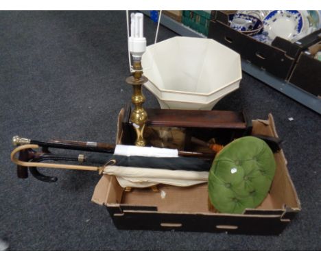 A box of wall clock, brass table lamp with shade, dralon footstool, bundle of sticks and parasol (one with silver mount)