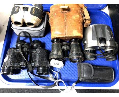 A tray of binoculars and field spectacles 