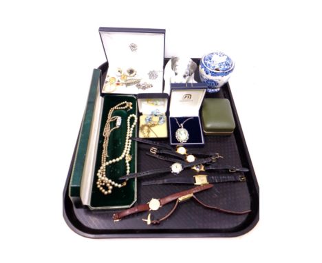 A tray of vintage wrist watches, Russian dog figure, costume pearls etc 