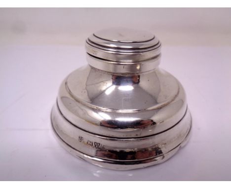 A silver Capstan inkwell.