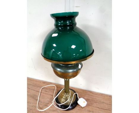 An antique style paraffin table lamp converted