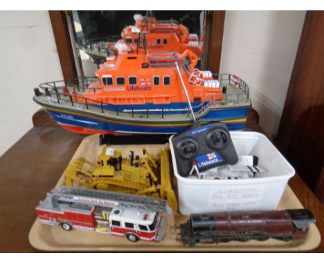 A tray of die cast vehicles, locomotive engine, lifeboat on stand with remote etc 