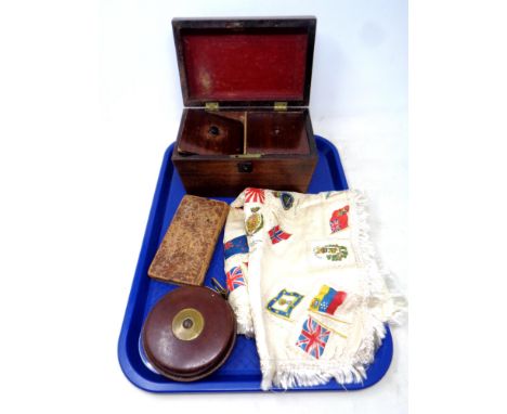 A tray of silk embroidered cloth, leather stitched tape measure, 19th century tea caddy, leather bound book 
