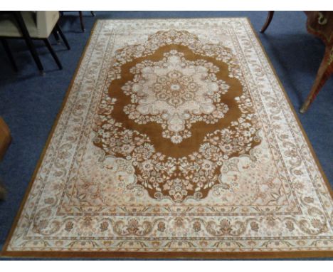 A woolen floral carpet on brown ground 201 cm x 295 cm.