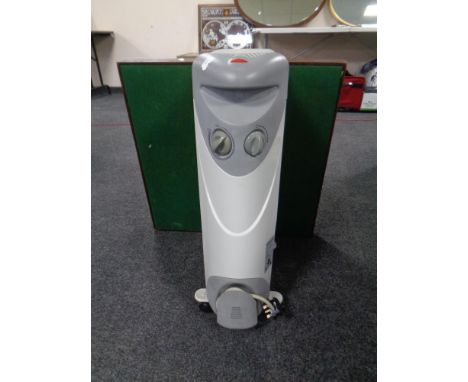 A Dimplex oil filled radiator together with a card table 