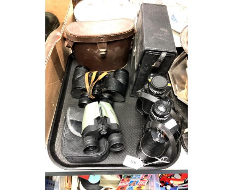 A tray of binoculars and optical items, Greenkat 8 x 40 binoculars etc 