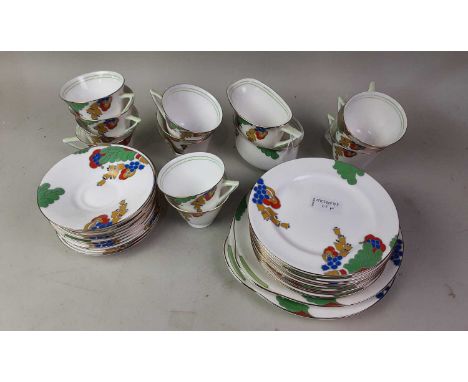 ROYAL DOULTON TEA SERVICE, OF ART DECO DESIGN transfer decorated with trailing foliage, comprising twelve cups, twelve saucer