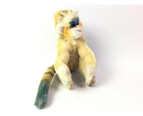 STEIFF "MUNGO" TOY MONKEY, ALONG WITH A TOY RABBIT the monkey with adjustable arms and legs, the rabbit modelled holding a ca