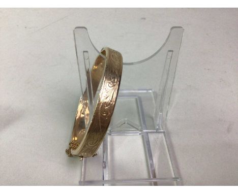 GOLD BANGLE, IN NINE CARAT GOLD with etched decoration, marked for nine carat gold6.5cm wideQty: 13.08g